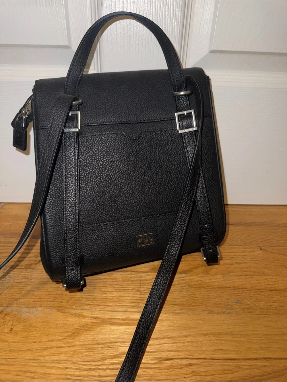 Black Structured Women’s Backpack with Silver Ring Accent